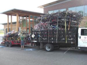 A volunteer checks out the 925 bikes on a truck