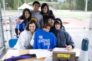 Freezing temperatures didn’t stop the Issaquah High School ASB and their first ever December Dash fundraiser for the Issaquah Food Bank. Here Liza Romanow holds up the first ever December Dash T-shirt as