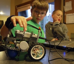 Erik Moulton and Graham Hanson get to grips with some robot programming during a recent afternoon meeting of their First Lego League club