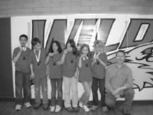 Discovery Elementary students show off their third place medals.