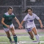Issaquah freshman midfielder Zoe Burns, right, tries to get around Woodinville senior forward Natalie Mifsud, left, in showdown with a berth in the Class 4A state soccer playoffs on the line. The Woodinville Falcons defeated the Issaquah Eagles soccer team 3-1 in a winner-to-state, loser-out KingCo tournament playoff game on Nov. 5 at Gary Moore Field in Issaquah. The Eagles finished the 2016 season with an overall record of 12-4-2.                                Photo courtesy of Rick Edelman/Rick Edelman Photography