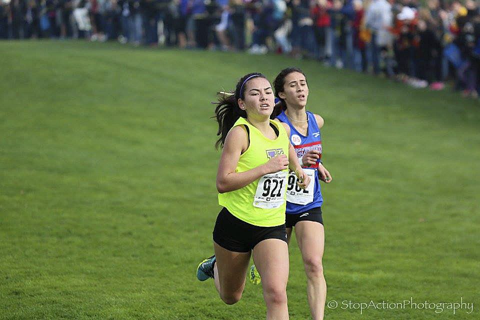 Issaquah junior Kenna Clawson captured ninth place individually at the Class 4A girls Cross Country state meet, clocking a time of 18:32.4. The Eagles girls Cross Country team captured first place overall in the Class 4A division, compiling 90 team points at the state meet on Nov. 5 in Pasco.                                Photo courtesy of Don Borin/Stop Action Photography