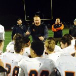 Eastside Catholic Crusaders head coach Jeremy Thielbahr, center, talks with his team following their 39-21 win against the Timberline Blazers on Nov. 11 at South Sound Stadium in Lacey.                                Shaun Scott, staff photo