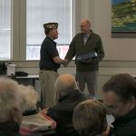 VFW Post 3436 Vice Commander David Waggoner presents Mayor Fred Butler, a fellow veteran, with a new flag for the city. Nicole Jennings/staff photo