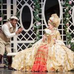 A wide variety of costumes were used for the show, which portrays 1920s film stars making a movie that takes place in the 1700s. Here, director Roscoe Dexter (played by Ty Willis) shows Lina Lamont (played by Jessica Skerritt) how to speak in her first ever talking-film. Photo courtesy of Village Theatre