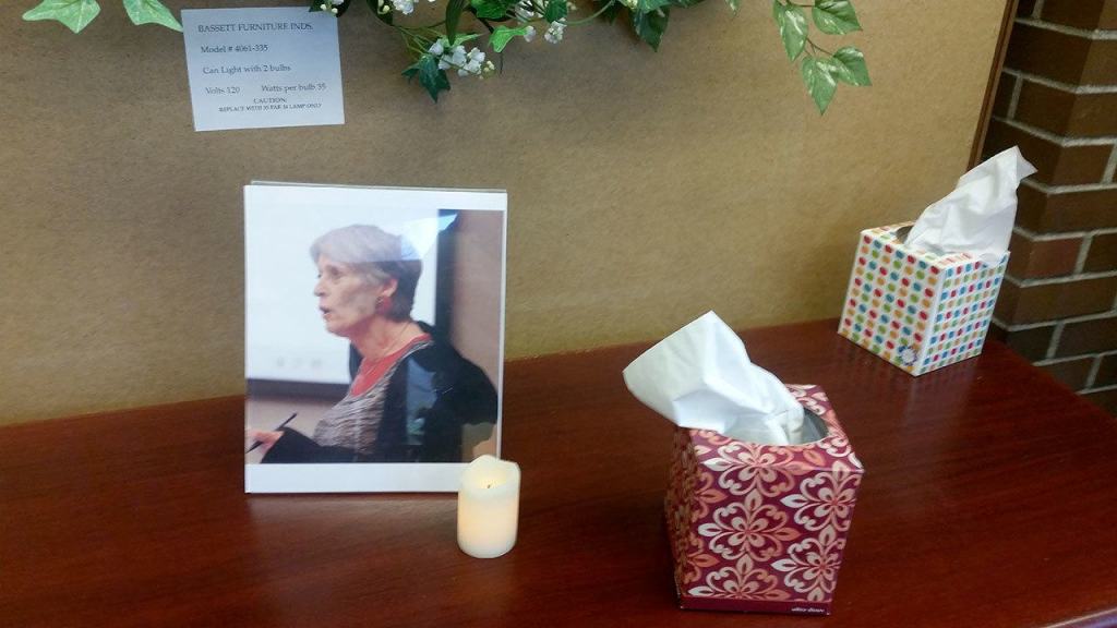 Seniors set up a memorial at the senior center to pay tribute to the late Regina Poirier, who was trespassed from the senior center for nearly the last two years of her life. Nicole Jennings/staff photo