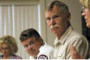Chief Lee Soptich (left) and Board of Directors Chair Ron Pedee listen to some of the ideas tossed around at the board meeting on Tuesday.