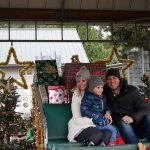 Guests are able to try out Santa&rsquo;s sleigh during the festival. 4-year-old Dylan Meyer smiles as he and his parents test out what it&rsquo;s like to be Saint Nick. Nicole Jennings/staff photo
