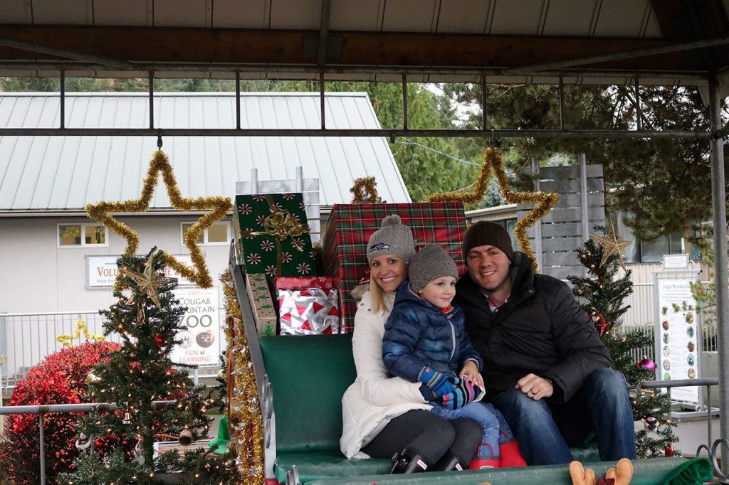 Guests are able to try out Santa&rsquo;s sleigh during the festival. 4-year-old Dylan Meyer smiles as he and his parents test out what it&rsquo;s like to be Saint Nick. Nicole Jennings/staff photo