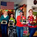 Nicole Jennings/staff photo                                Recology&rsquo;s Golden Dumpster Awards were presented to, from left, Heather Hansen of Lake Sammamish State Park, Connie Marsh of Doubletake Vintage and Consignment and Guiness Ayers and Donna Androwski of REI.