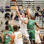 Issaquah Eagles senior Tanner Davis poured in a game-high 37 points against the Woodinville Falcons in a Class 4A KingCo contest on Dec. 12. The Eagles defeated the Falcons 74-63.                                Photo courtesy of Rick Edelman/Rick Edelman Photography