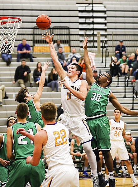Issaquah Eagles senior Tanner Davis poured in a game-high 37 points against the Woodinville Falcons in a Class 4A KingCo contest on Dec. 12. The Eagles defeated the Falcons 74-63.                                Photo courtesy of Rick Edelman/Rick Edelman Photography