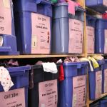 Shelves in the EBC warehouse are full of clothing for all ages. Nicole Jennings/staff photo