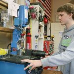 X39 Brick Customs founder Payton Dean operates his CNC machine in his Sammamish shop. Joe Livarchik/staff photo.