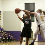 Photo courtesy of Don Borin/Stop Action Photography                                Eastlake Wolves junior Gina Marxen, left, takes the ball strong to the hoop against Issaquah defender Lucy Stewart, right, in a matchup between KingCo 4A teams on Jan. 6 at Issaquah High School. The Wolves defeated the Eagles 74-42.