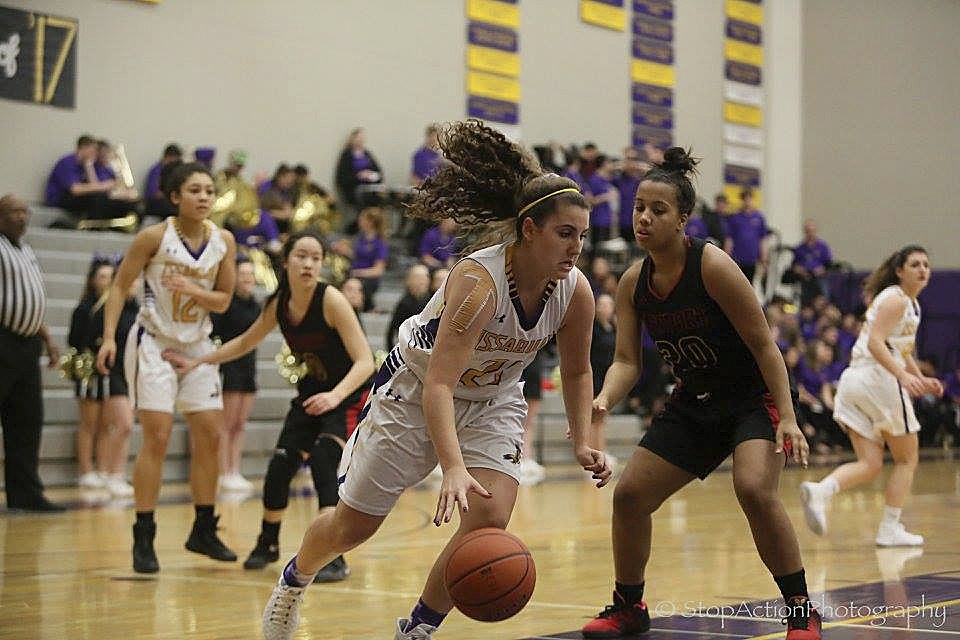 Photo courtesy of Don Borin/Stop Action Photography                                Issaquah forward Mariah VanHalm drives to the basket while being guarded by Newport defender Jahdai Alcombrack in a matchup between KingCo 4A teams on Jan. 13 at Issaquah High School. The Eagles defeated the Knights 48-39.