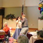 New Senior Center Manager Katie Moeller, dressed for the occasion in a blouse and poodle skirt, danced to Elvis&rsquo;s lively tunes. Nicole Jennings/staff photo