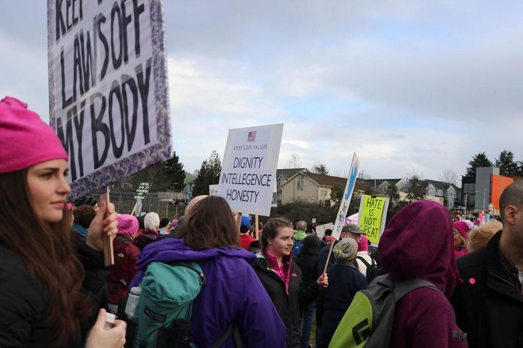 At first the marchers gathered at Judkins Park, packing the park with creative signs advocating a variety of causes. Nicole Jennings/staff photo