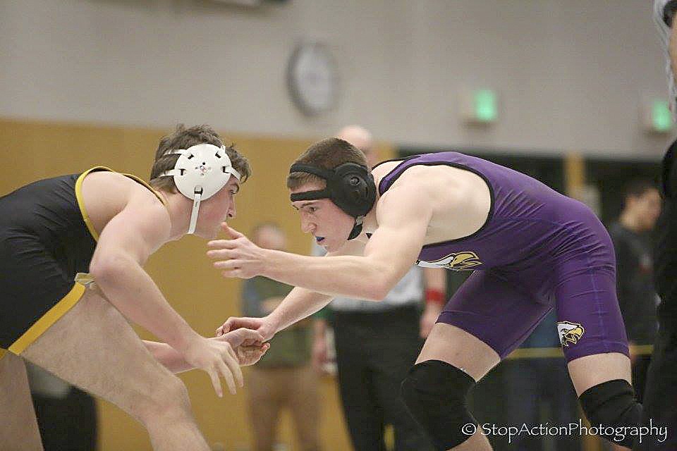 Issaquah Eagles grappler Dean Pearson, right, earned second place in the 182-pound weight class at the Class 4A Region II wrestling tournament on Feb. 11 at Skyline High School. Pearson will compete in the Class 4A Mat Classic state wrestling tournament on Feb. 17 at the Tacoma Dome.
