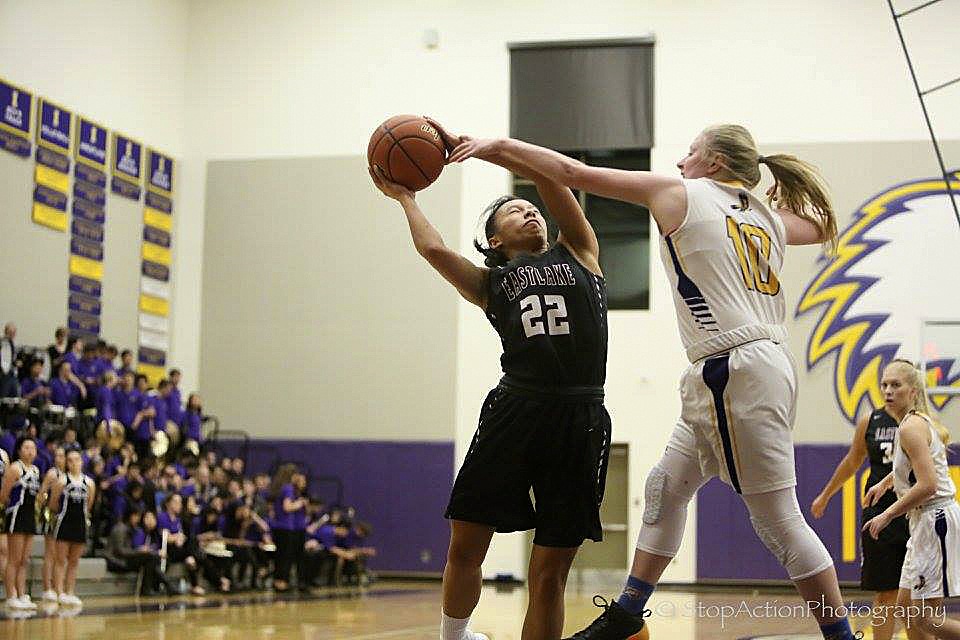 Photo courtesy of Don Borin/Stop Action Photography                                Eastlake Wolves junior Gina Marxen, left, takes the ball to the hoop against the Issaquah Eagles on Jan. 6. Marxen was named the KingCo 4A girls basketball co-MVP for her performance during the 2016-17 season. Marxen and Bothell senior Taya Corosdale were named all-KingCo co-MVPs after a meeting with KingCo 4A coaches took place on Feb. 13.