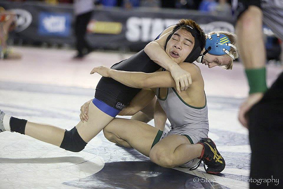 Photo courtesy of Don Borin/Stop Action Photography                                Skyline Spartans sophomore Kenta Despe, right, captured a sixth place finish in the Class 4A Mat Classic state wrestling tournament on Feb. 18.
