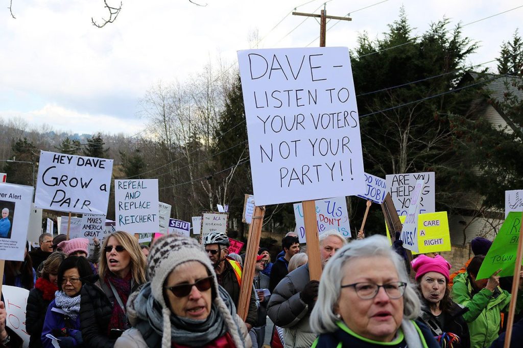 Affordable Care Act, immigration headline concerns of 1,000 anti-Reichert protesters