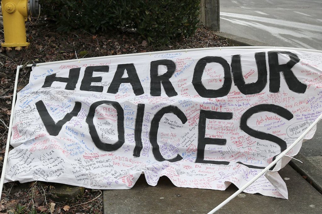 Protesters left this sign in front of Reichert&rsquo;s office as a way to leave written documentation of their concerns for the congressman. Nicole Jennings/staff photo