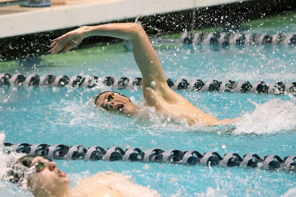 Issaquah&rsquo;s Kyle Millis begins to turn while competing in the 100 back. Millis won the event with a time of 50.25 (Joe Livarchik/staff photo).