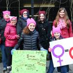 The Plateaupians organized buses to take nearly 1,000 Eastside residents to the Seattle Women&rsquo;s March in January. Participants carried signs advocating peace and compassion for others. Nicole Jennings/staff photo