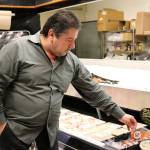 Nicole Jennings/staff photo                                Kathawa stocks as many locally-produced items as possible at the market, such as Steve&rsquo;s Hot Smoked Salmon from Buckley.