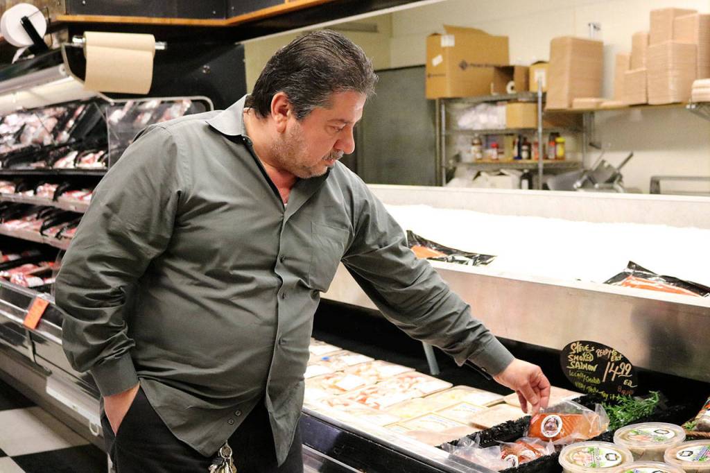 Nicole Jennings/staff photo                                Kathawa stocks as many locally-produced items as possible at the market, such as Steve&rsquo;s Hot Smoked Salmon from Buckley.