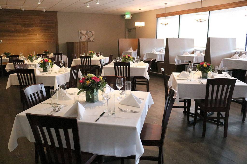 Floral decor can be found on every table linen of the new 62-seat restaurant (Joe Livarchik/staff photo).