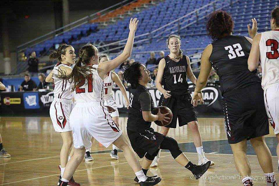 Photo courtesy of Don Borin/Stop Action Photography                                Eastlake Wolves junior Elizabeth Chen, center, takes the ball toward the hoop against the Camas Papermakers in the first round of the Class 4A state tournament on March 1 at the Tacoma Dome. Camas defeated Eastlake 44-36. The Wolves finished the 2016-17 season with an overall record of 19-7.