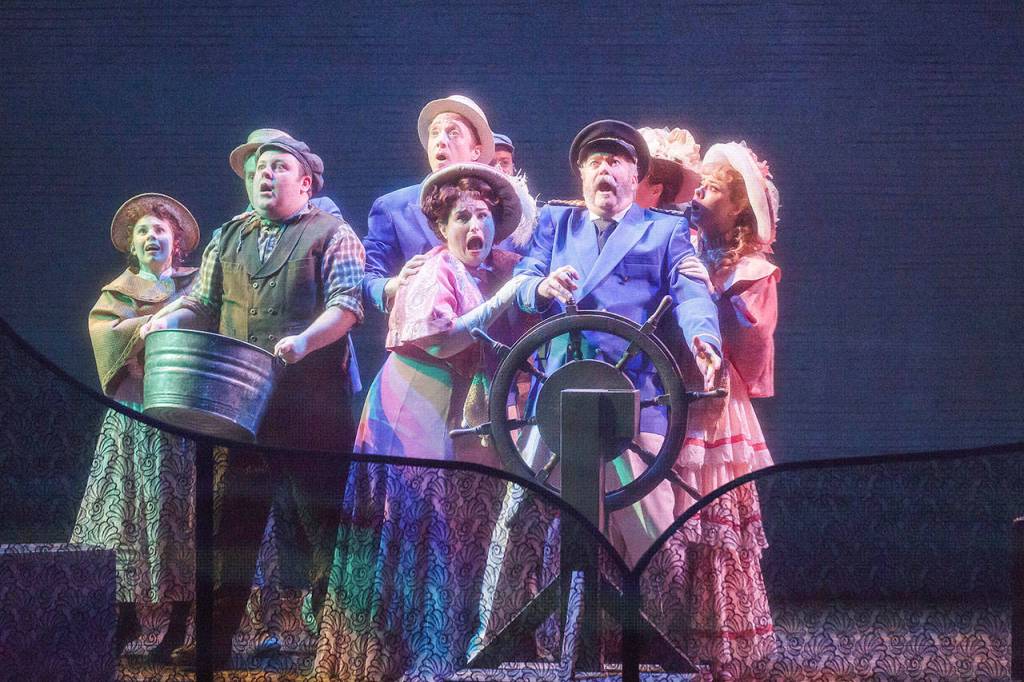 The show vividly portrays the storm that the Lasenbys encounter, making it seem as though thunder and lightning are taking place in the theatre. Photo courtesy of Village Theatre