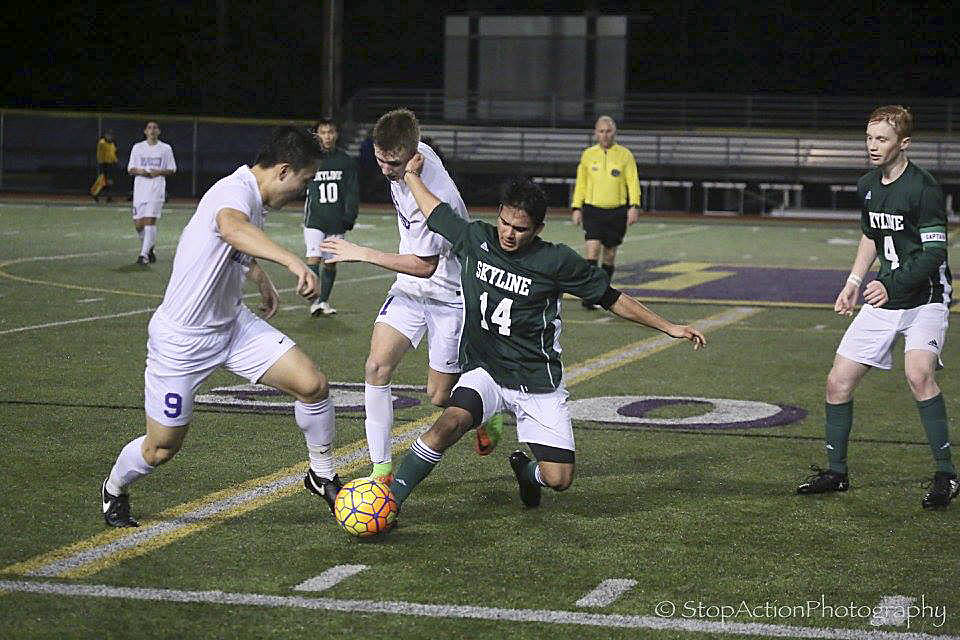 Photo courtesy of Don Borin/Stop Action Photography                                Issaquah Eagles players Issac Chai, left, and Jack MacDonald, center, battle with Skyline sophomore Sebastian Miller, right, for possession of the ball in a matchup between rival teams. The Eagles and Spartans battled to a 0-0 draw on March 24 at Gary Moore Stadium in Issaquah.