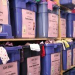 Shelves in the EBC warehouse are full of clothing for all ages. Nicole Jennings/staff photo