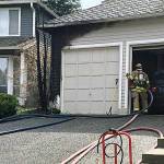 Eastside Fire and Rescue firefighters responded to a tree fire that spread to a nearby garage in the Klahanie neighborhood of Sammamish on Saturday (photo courtesy of Captain Steve Westlake/Eastside Fire and Rescue).
