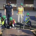 In a simulation of a real-life disaster at the April 6 Issaquah CERT class, class members practice cribbing, which is used to rescue people trapped under pieces of debris. Nicole Jennings/staff photo