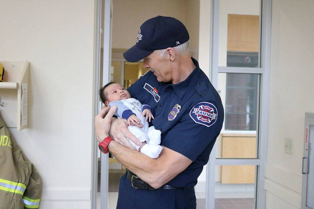 For Eastside Firefighter Mark Leroy, helping to bring baby Benjamin into the world was a happy emergency call. Nicole Jennings/staff photo