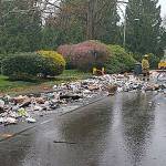 Recycling truck dumps haul of materials after fire breaks out in rear of vehicle