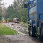 Recycling truck dumps haul of materials after fire breaks out in rear of vehicle