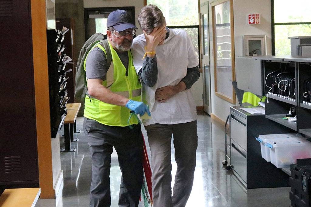 Part of the medical triage process included knowing when to sit and comfort a victim with more emotional than physical pain, and when to make the difficult decision to leave the person&rsquo;s side to search for and aid people with more serious injuries. Nicole Jennings/staff photo