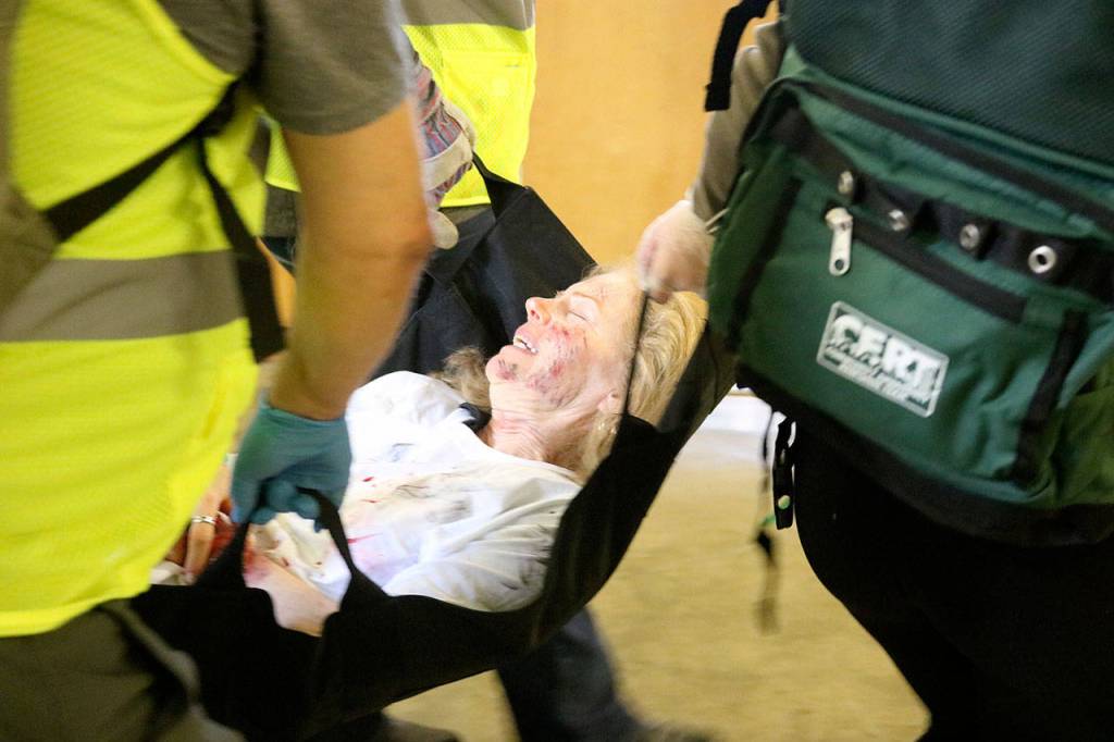 Class members practiced carrying victims on makeshift stretchers. Nicole Jennings/staff photo