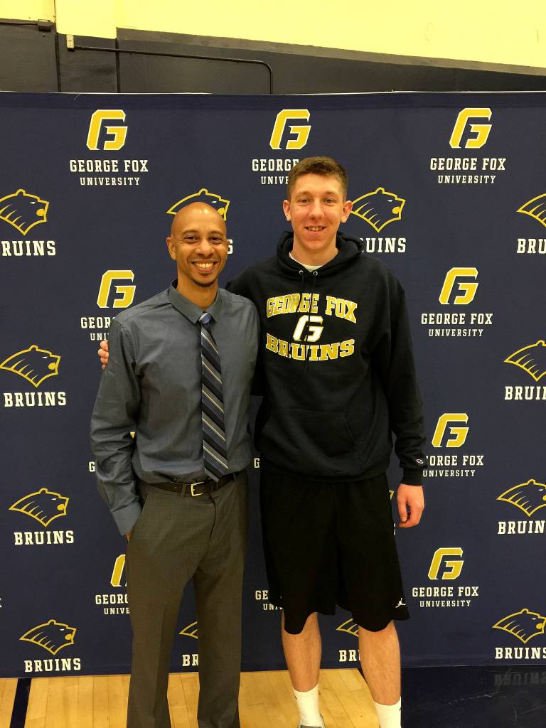 Photo courtesy of Stephanie Wilson                                Issaquah Eagles boys basketball player Brent Wilson (right) committed to the George Fox University men&rsquo;s basketball program on April 24. Wilson, who plays in the post, led the KingCo 4A Conference in blocked shots per game during the 2016-17 season. George Fox University is coached by Maco Hamilton (left).