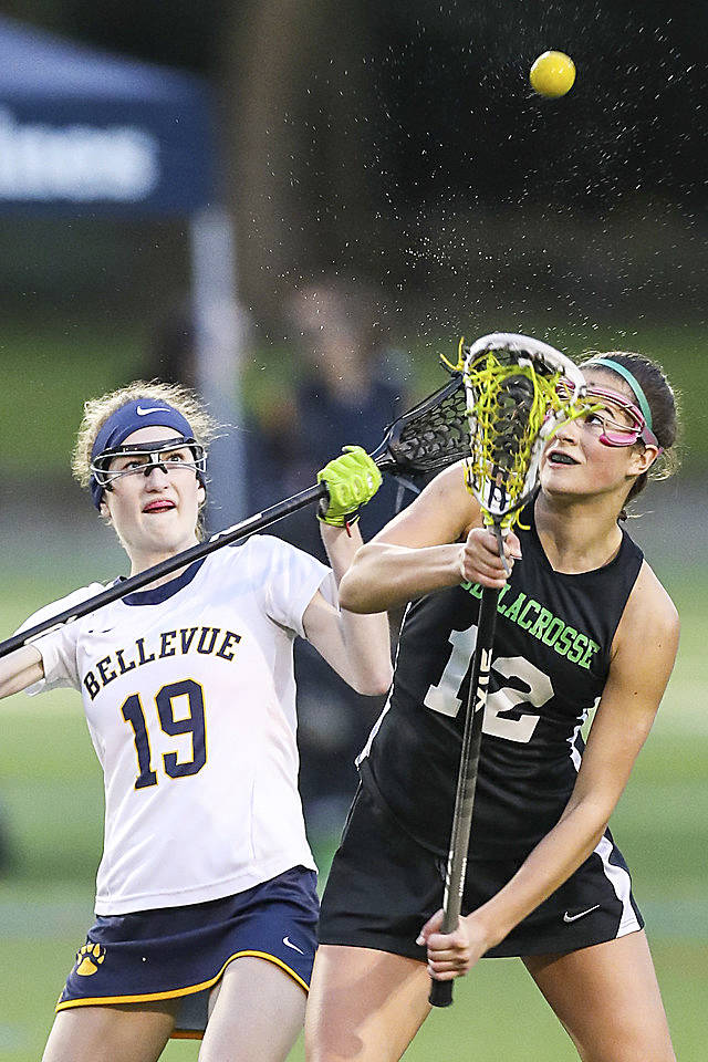 Photo courtesy of Rick Edelman/Rick Edelman Photography                                The Issaquah School District girls lacrosse team captured a 19-3 win against the Bellevue Wolverines on April 26 at Robinswood Park in Bellevue. Issaquah improved their overall record 9-1 with the win while Bellevue dropped to 3-5. Issaquah player Julia Hepperle, right, and Bellevue player Kimberly Nickerson, left, battle to gain possession of the ball.