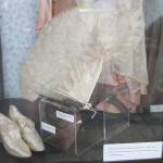 The new exhibit shows everything a true flapper would need for a night out, such as a feathered fan for flirting and satin dance slippers. Nicole Jennings/staff photo