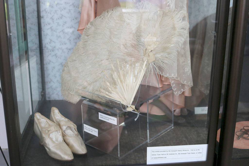 The new exhibit shows everything a true flapper would need for a night out, such as a feathered fan for flirting and satin dance slippers. Nicole Jennings/staff photo