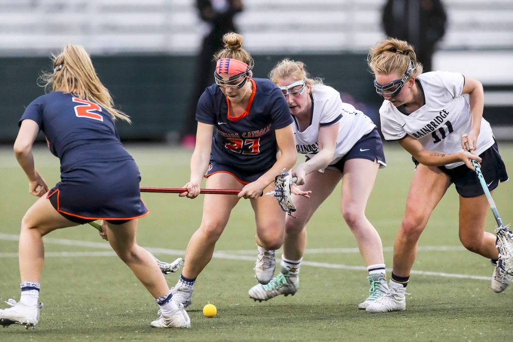Photo courtesy of Rick Edelman/Rick Edelman Photography                                Eastside Catholic senior Carlin Reilly, center, tries to gain control of the ball. Reilly scored a team-high five goals in the final game of her high school career.