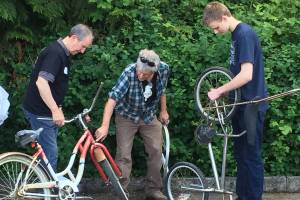 Volunteers help get donated bikes ready to ship to Africa. Photos courtesy of Mary Trask