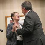 Alan Finkelstein, winner of the chamber&rsquo;s Business Person of the Year Award, hugs Chamber of Commerce Director Kathy McCorry as he ascends the stage. Carrie Rodriguez/staff photo